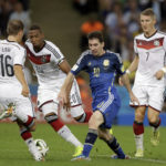 
              FILE - Argentina's Lionel Messi, second right, is challenged by, from left, Germany's Philipp Lahm, Jerome Boateng and Bastian Schweinsteiger during the World Cup final soccer match between Germany and Argentina at the Maracana Stadium in Rio de Janeiro, Brazil, Sunday, July 13, 2014. (AP Photo/Victor R. Caivano, File)
            