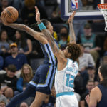 
              Memphis Grizzlies guard Ja Morant shoots against Charlotte Hornets guard Kelly Oubre Jr. (12) during the first half of an NBA basketball game Friday, Nov. 4, 2022, in Memphis, Tenn. (AP Photo/Brandon Dill)
            
