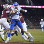 
              BYU tight end Isaac Rex (83) scores a touchdown against Stanford during the first half of an NCAA college football game in Stanford, Calif., Saturday, Nov. 26, 2022. (AP Photo/Godofredo A. Vásquez)
            