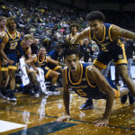 
              UC Irvine forward Chazz Hutchison (5) reacts with guard Justin Hohn (2) and the rest of the UC Irvine bench Hutchison was fouled on a shot during the second half of the team's NCAA college basketball game Oregon on Friday, Nov. 11, 2022, in Eugene, Ore. (AP Photo/Andy Nelson)
            