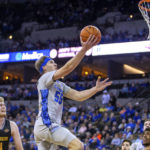 
              Creighton's Baylor Scheierman (55) makes a layup against UC Riverside during the first half of an NCAA college basketball game Thursday, Nov. 17, 2022, in Omaha, Neb. (AP Photo/John Peterson)
            