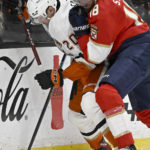
              Anaheim Ducks right wing Brett Leason, left, vies for the puck with Florida Panthers defenseman Marc Staal during the first period of an NHL hockey game in Anaheim, Calif., Sunday, Nov. 6, 2022. (AP Photo/Alex Gallardo)
            