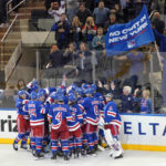 
              The New York Rangers celebrate after left wing Chris Kreider scored against the Philadelphia Flyers during overtime of an NHL hockey game, Tuesday, Nov. 1, 2022, at Madison Square Garden in New York. The Rangers won 1-0. (AP Photo/Mary Altaffer)
            