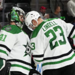 
              Dallas Stars goaltender Scott Wedgewood (41) celebrates with defenseman Esa Lindell (23) after the team's 7-2 win over the Arizona Coyotes in an NHL hockey game in Tempe, Ariz., Thursday, Nov. 3, 2022. (AP Photo/Ross D. Franklin)
            