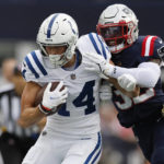 
              Indianapolis Colts wide receiver Alec Pierce (14) is pushed out of bounds by New England Patriots safety Devin McCourty (32) in the first half of an NFL football game, Sunday, Nov. 6, 2022, in Foxborough, Mass. (AP Photo/Michael Dwyer)
            