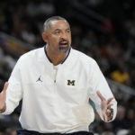 
              Michigan head coach Juwan Howard yells from the sideline during the first half of an NCAA college basketball game against Eastern Michigan, Friday, Nov. 11, 2022, in Detroit. (AP Photo/Carlos Osorio)
            