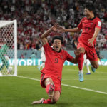 
              South Korea's Cho Gue-sung, center, celebrates with South Korea's Na Sang-ho, right, after scoring his side's second goal during the World Cup group H soccer match between South Korea and Ghana, at the Education City Stadium in Al Rayyan, Qatar, Monday, Nov. 28, 2022. (AP Photo/Lee Jin-man)
            
