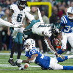 
              Philadelphia Eagles wide receiver A.J. Brown (11) dives over ndianapolis Colts safety Julian Blackmon (32) in the first half of an NFL football game in Indianapolis, Sunday, Nov. 20, 2022. Pass interference negated the play. (AP Photo/Darron Cummings)
            