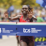 
              Sharon Lokedi, of Kenya, crosses the finish line first in the women's division of the New York City Marathon, Sunday, Nov. 6, 2022, in New York. (AP Photo/Jason DeCrow)
            