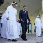 
              United States Secretary of State Antony Blinken, right, and Qatar Foreign Minister Mohammed Bin Adbulrahman Al Thani, left, walk to a media event at the Diplomatic Club, in Tuesday, Nov. 22, 2022. America's top diplomat criticized a decision by FIFA to threaten players at the World Cup with yellow cards if they wear armbands supporting inclusion and diversity. (AP Photo/Ashley Landis)
            