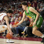 
              Iowa State guard Caleb Grill (2) steals the ball from North Dakota guard Treysen Eaglestaff (52) during the second half of an NCAA college basketball game, Wednesday, Nov. 30, 2022, in Ames, Iowa. Iowa State won 63-44. (AP Photo/Charlie Neibergall)
            