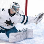 
              San Jose Sharks goaltender Kaapo Kahkonen deflects the puck off his glove during the first period of the tema's NHL hockey game against the Montreal Canadiens on Tuesday, Nov. 29, 2022, in Montreal. (Paul Chiasson/The Canadian Press via AP)
            