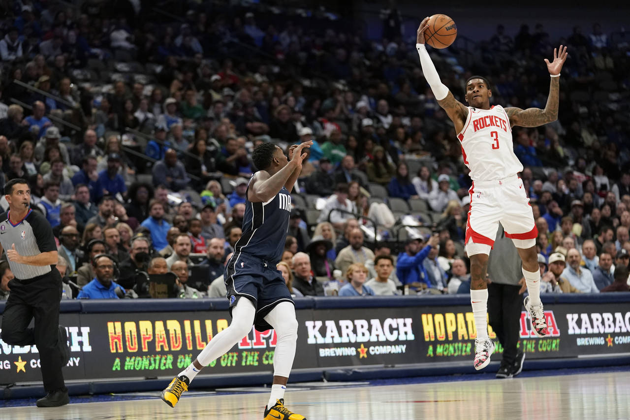 Houston Rockets guard Kevin Porter Jr. (3) steals a pass meant for Dallas Mavericks forward Dorian ...