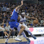 
              Orlando Magic center Wendell Carter Jr., right, drives to the basket while defended by Dallas Mavericks center JaVale McGee (00) during the second half of an NBA basketball game, Wednesday, Nov. 9, 2022, in Orlando, Fla. (AP Photo/Phelan M. Ebenhack)
            