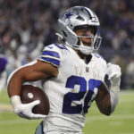 
              Dallas Cowboys running back Tony Pollard runs up field during a 68-yard touchdown reception in the second half of an NFL football game against the Minnesota Vikings, Sunday, Nov. 20, 2022, in Minneapolis. (AP Photo/Bruce Kluckhohn)
            