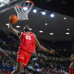 
              Houston forward Jarace Walker (25) dunks on a pass from guard Marcus Sasser during the second half of the team's NCAA college basketball game against Saint Joseph's at the Veterans Classic, Friday, Nov. 11, 2022, in Annapolis, Md. (AP Photo/Terrance Williams)
            
