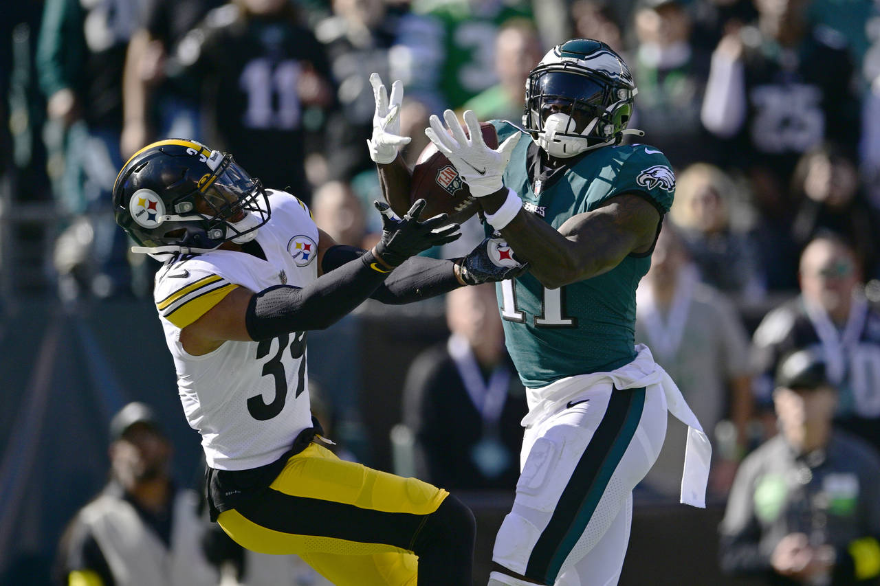 Philadelphia Eagles wide receiver A.J. Brown (11) catches a touchdown pass while being defended by ...