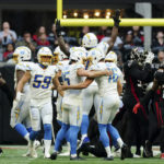 
              Los Angeles Chargers place kicker Cameron Dicker (15) celebrates with teammate JK Scott after kicking a 37-yard field goal on the final play of an NFL football game against the Atlanta Falcons, Sunday, Nov. 6, 2022, in Atlanta. The Chargers won 20-17. (AP Photo/John Bazemore)
            