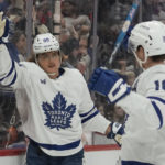 
              Toronto Maple Leafs right wing William Nylander, left, celebrates his goal with Mitchell Marner (16) in the first period of an NHL hockey game against the Detroit Red Wings Monday, Nov. 28, 2022, in Detroit. (AP Photo/Paul Sancya)
            