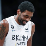 
              Brooklyn Nets guard Kyrie Irving reacts after scoring against the Memphis Grizzlies during the second half of an NBA basketball game Sunday, Nov. 20, 2022, in New York. (AP Photo/Eduardo Munoz Alvarez)
            