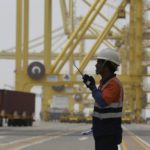 
              A port employee works at Hamad Port, about 25 kms south of Doha, Qatar on May 6, 2019. Qatar is home to roughly 2.6 million people, but a tiny fraction of that — around 12% — are Qatari citizens. They enjoy massive wealth and benefits fueled by Qatar's shared control of one of the world's largest reserves of natural gas. (AP Photo/Kamran Jebreili)
            