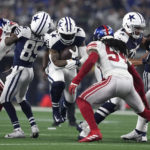 
              Dallas Cowboys running back Ezekiel Elliott (21) rushes against the New York Giants during the first half of an NFL football game Thursday, Nov. 24, 2022, in Arlington, Texas. (AP Photo/Tony Gutierrez)
            