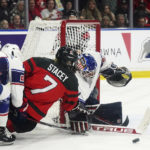 
              U.S. goaltender Nicole Hensley (29) makes a save on Canada's Laura Stacey (7) as United States' Gabby Rosenthal (24) defends during the second period of a Rivalry Series hockey game Tuesday, Nov. 15, 2022, in Kelowna, British Columbia. (Jesse Johnston/The Canadian Press via AP)
            