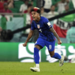 
              United States' Weston McKennie (8) celebrates after teammate Christian Pulisic scoring a goal during the World Cup group B soccer match between Iran and the United States at the Al Thumama Stadium in Doha, Qatar, Tuesday, Nov. 29, 2022. (AP Photo/Ashley Landis)
            