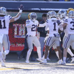 
              Kansas State players celebrate after a defensive touchdown against West Virginia during the first half of an NCAA college football game in Morgantown, W.Va., Saturday, Nov. 19, 2022. (AP Photo/Kathleen Batten)
            