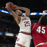 
              Indiana forward Race Thompson (25) grabs a rebound against Miami (Ohio) forward Anderson Mirambeaux (45) during the first half of an NCAA college basketball game, Sunday, Nov. 20, 2022, in Indianapolis. (AP Photo/Marc Lebryk)
            