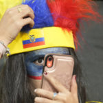 
              A Ecuador's fan adjusts her hat before the World Cup group A soccer match between Netherlands and Ecuador at the Khalifa International Stadium in Doha, Qatar, Friday, Nov. 25, 2022. (AP Photo/Darko Vojinovic)
            