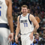 
              Dallas Mavericks guard Luka Doncic (77) has a laugh on the floor during the first half of an NBA basketball game against the Los Angeles Clippers in Dallas, Tuesday, Nov. 15, 2022. (AP Photo/LM Otero)
            
