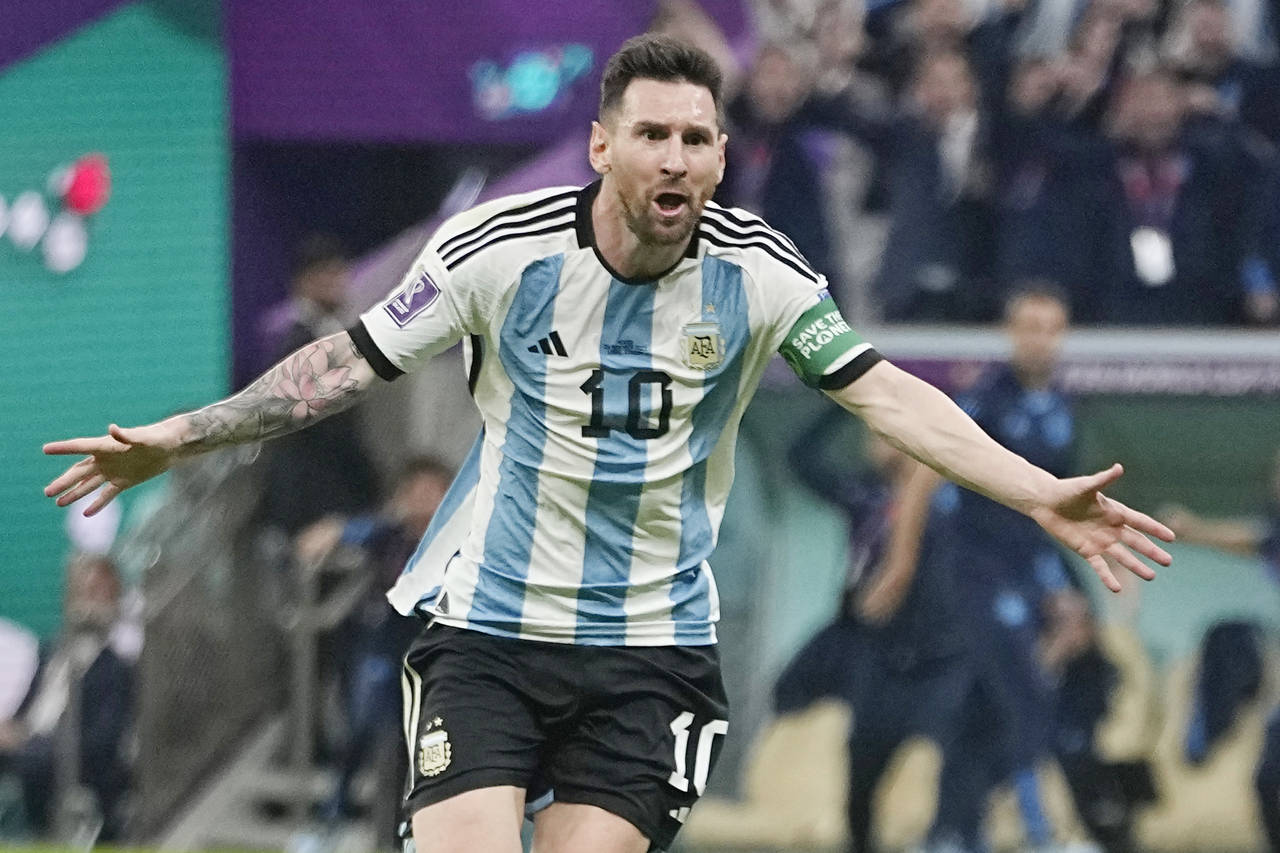 Argentina's Lionel Messi celebrates after scoring his side's opening goal during the World Cup grou...