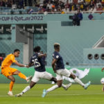 
              Cody Gakpo of the Netherlands, left, scores the opening goal during the World Cup group A soccer match between Netherlands and Ecuador, at the Khalifa International Stadium in Doha, Qatar, Friday, Nov. 25, 2022. (AP Photo/Natacha Pisarenko)
            