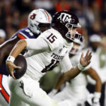 
              Texas A&M quarterback Conner Weigman (15) carries the ball against Auburn during the first half of an NCAA college football game, Saturday, Nov. 12, 2022, in Auburn, Ala. (AP Photo/Butch Dill)
            