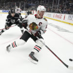 
              Chicago Blackhawks center Jonathan Toews, right, takes the puck while under pressure from Los Angeles Kings defenseman Sean Durzi during the third period of an NHL hockey game Thursday, Nov. 10, 2022, in Los Angeles. (AP Photo/Mark J. Terrill)
            