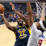 
              Indiana Pacers forward Isaiah Jackson, left, shoots as Los Angeles Clippers center Moses Brown defends during the first half of an NBA basketball game Sunday, Nov. 27, 2022, in Los Angeles. (AP Photo/Mark J. Terrill)
            