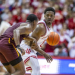 
              Indiana guard Xavier Johnson brings the ball up the court while being defended by Bethune-Cookman guard Marcus Garrett during the second half of an NCAA college basketball game, Thursday, Nov. 10, 2022, in Bloomington, Ind. (AP Photo/Doug McSchooler)
            