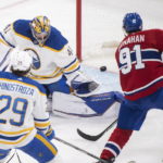 
              Montreal Canadiens' Sean Monahan (91) scores against Buffalo Sabres goaltender Craig Anderson during the second period of an NHL hockey game in Montreal, Tuesday, Nov. 22, 2022. (Graham Hughes/The Canadian Press via AP)
            