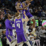 
              Sacramento Kings guard De'Aaron Fox (5) celebrates with his team after his 3-point final shot against the Orlando Magic during overtime of an NBA basketball game, Saturday, Nov. 5, 2022, in Orlando, Fla. (AP Photo/Kevin Kolczynski)
            