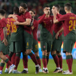 
              Portugal players embrace before the start of an international friendly soccer match between Portugal and Nigeria at the Jose Alvalade stadium in Lisbon, Thursday, Nov. 17, 2022. The Portuguese team will leave for Qatar on Friday for the World Cup. (AP Photo/Armando Franca)
            