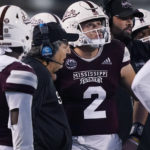 
              Mississippi State coach Mike Leach confers with quarterback Will Rogers (2) during the second half of an NCAA college football game against Auburn in Starkville, Miss., Saturday, Nov. 5, 2022. Mississippi State won 39-33. (AP Photo/Rogelio V. Solis)
            