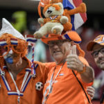 
              Netherlands supporters pose for a picture prior the start the World Cup group A soccer match between the Netherlands and Qatar, at the Al Bayt Stadium in Al Khor , Qatar, Tuesday, Nov. 29, 2022. (AP Photo/Moises Castillo)
            