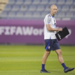 
              Head coach Gregg Berhalter of the United States walks on the pitch during an official training session at Al Gharafa SC Stadium, in Doha, Sunday, Nov. 27, 2022. (AP Photo/Ashley Landis)
            
