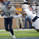 
              Rice wide receiver Bradley Rozner (2) pushes off the tackle attempt by UTEP safety Ty'Reke James (3) during the first half of an NCAA college football game Thursday, Nov. 3, 2022, in Houston. (AP Photo/Michael Wyke)
            