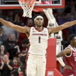 
              Arkansas guard Ricky Council IV (1) celebrates after scoring against Troy during the first half of an NCAA college basketball game, Monday, Nov. 28, 2022, in Fayetteville, Ark. (AP Photo/Michael Woods)
            