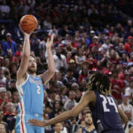 
              Gonzaga forward Drew Timme (2) shoots while defended by North Florida forward Jadyn Parker (24) during the first half of an NCAA college basketball game, Monday, Nov. 7, 2022, in Spokane, Wash. (AP Photo/Young Kwak)
            