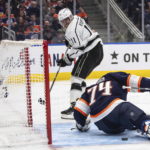 
              Los Angeles Kings' Anze Kopitar (11) is stopped by Edmonton Oilers goalie Stuart Skinner (74) during the first period of an NHL hockey game Wednesday, Nov. 16, 2022, in Edmonton, Alberta. (Jason Franson/The Canadian Press via AP)
            