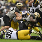 
              Purdue running back Kobe Lewis (25) is tackled during the second half of an NCAA college football game against Iowa, Saturday, Nov. 5, 2022, in West Lafayette, Ind. (AP Photo/Marc Lebryk)
            