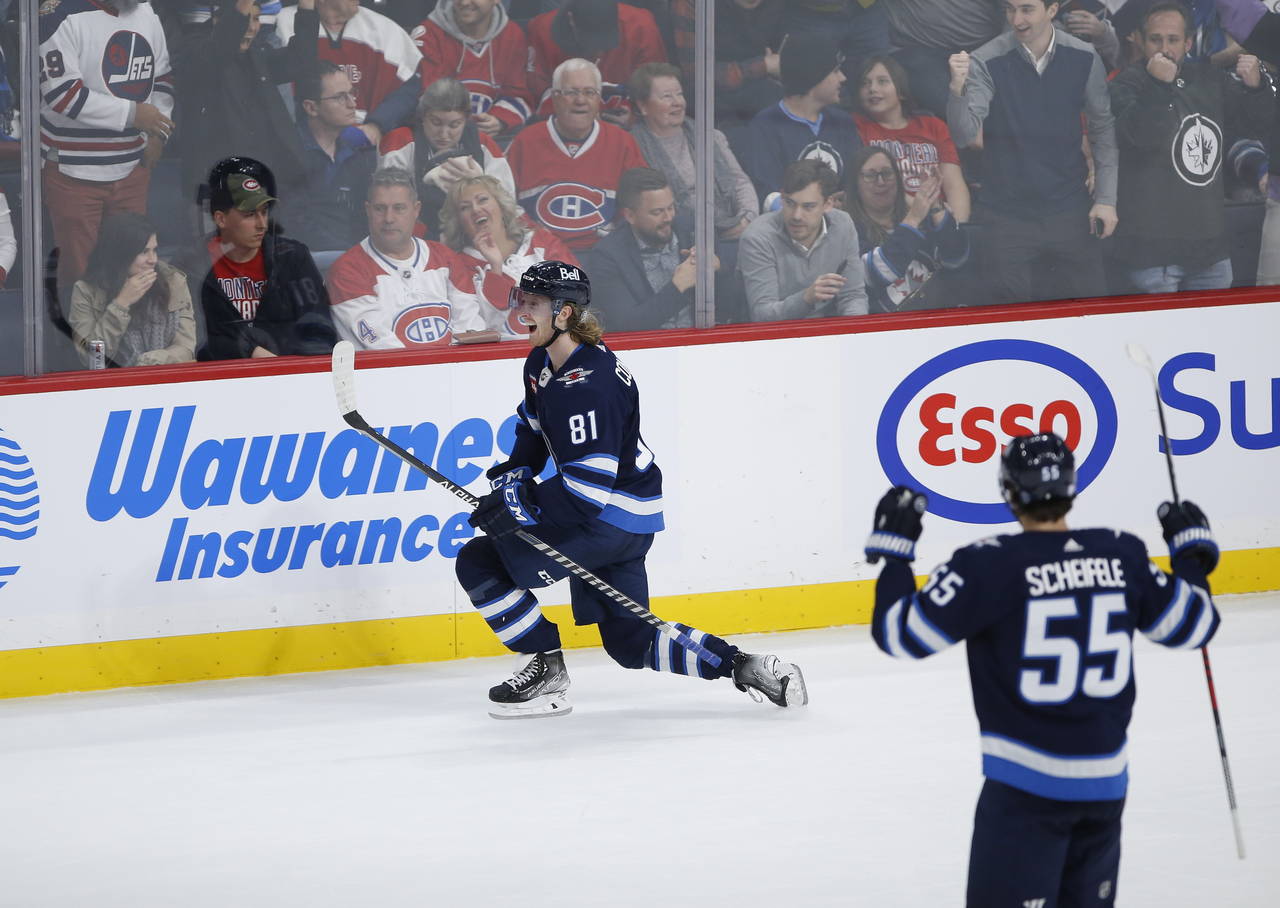 Winnipeg Jets' Kyle Connor (81) celebrates his overtime goal against the Montreal Canadiens during ...